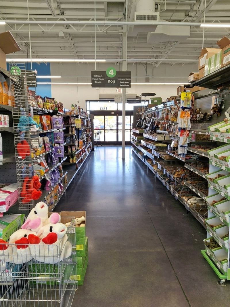A long aisle of dog food bags